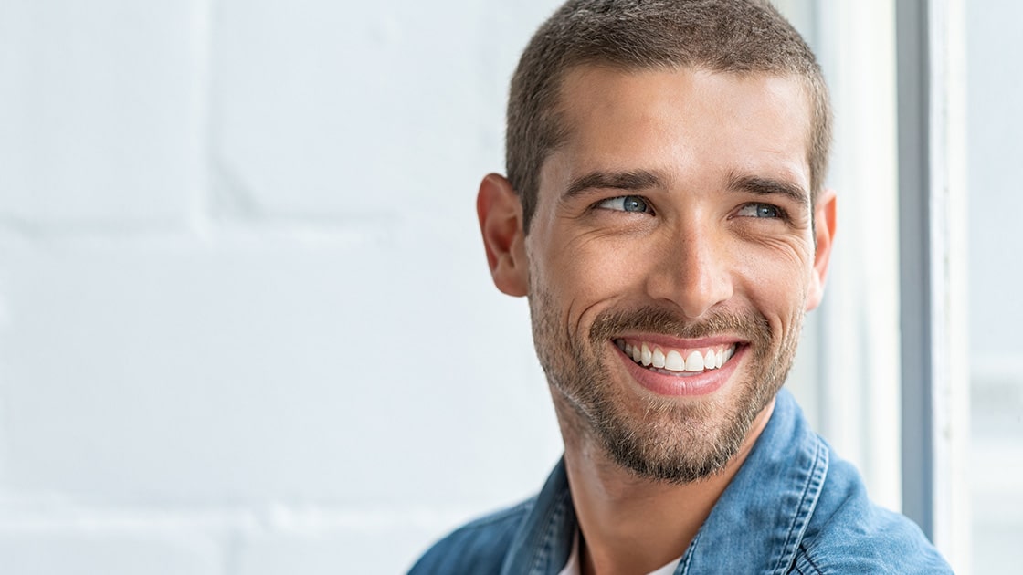 man with dental veneers smiling